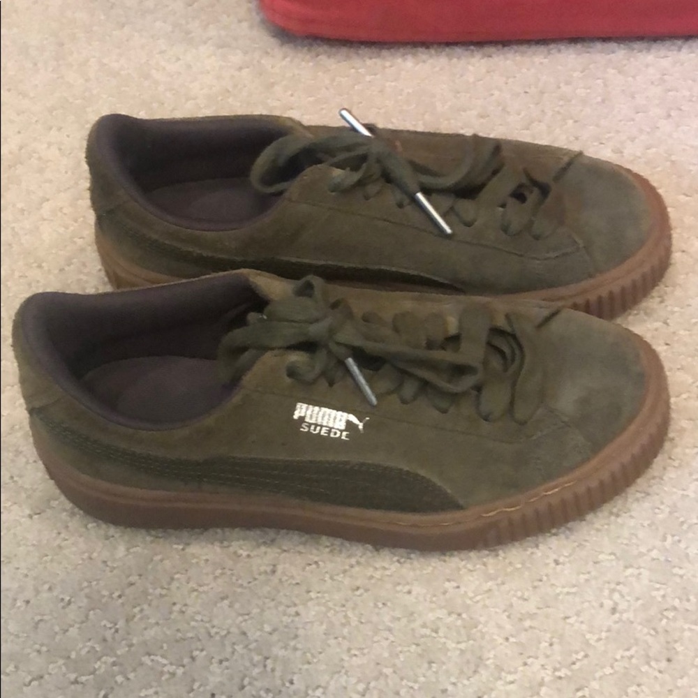 Dark green suede pumas